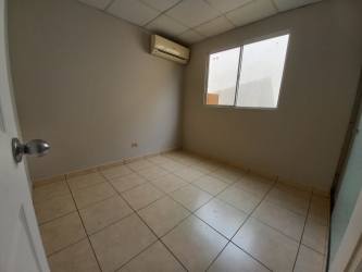 Master bedroom with window and air conditioner in Chorrera Panama rental home