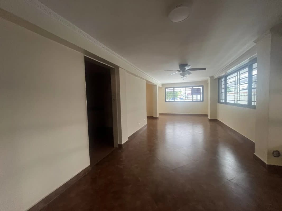 Kitchen with cabinets and tiled backsplash in duplex house commercial residential Panama