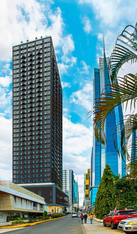 One-bedroom condo interior with floor-to-ceiling window view of Panama skyline Walker Wellness