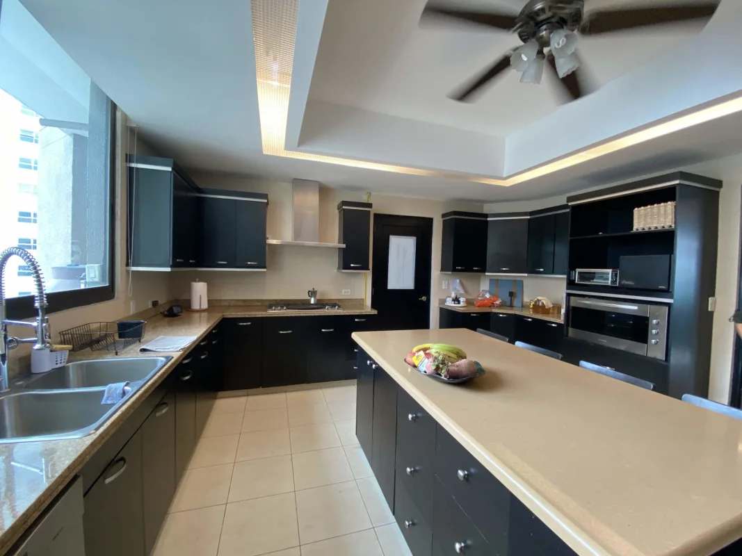 Luxury penthouse living area with panoramic ocean view windows in PH Ocean Club Punta Pacifica Panama