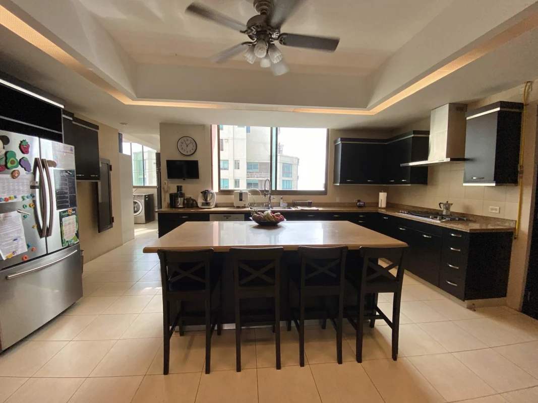 Elegant dining area with marble floors and skyline views in PH Ocean Club penthouse Panama