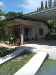 Affordable modern bungalow with carport, landscaped front yard in Los Algarrobos Dolega Panama