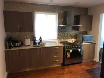 Kitchen with granite countertops, stainless appliances in modern house for sale Panama Pacifico