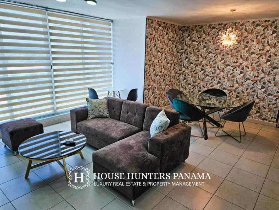 Living and dining space with city view balcony in PH Miró El Cangrejo Panama City