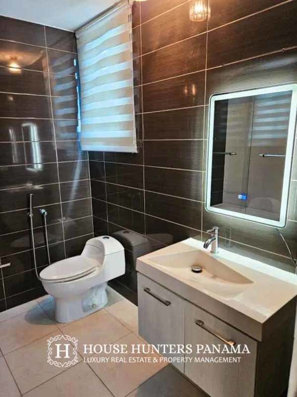 Contemporary bedroom with accent wall and large window in PH Miró El Cangrejo Panama