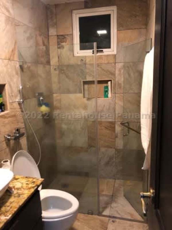 Modern kitchen with granite countertops, open design in remodeled house at Altos de Panama