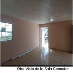 Living and dining area with tiled floors and large window at house for sale Las Lomas