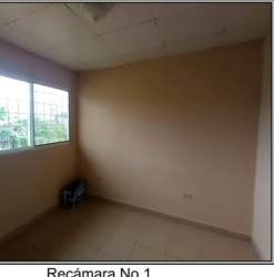 Basic kitchen with stove sink and security window in house for sale Las Lomas David