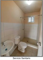 Bathroom with shower, sink, tiled walls in Las Lomas house for sale Panama