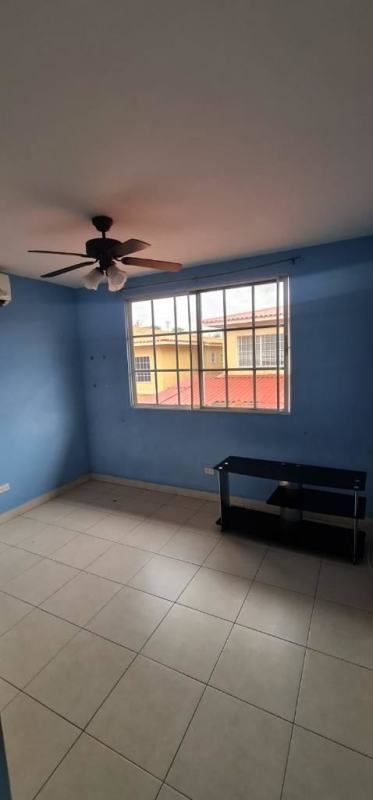 Contemporary living room with sliding doors, tiled floors in Dorado Lake Residence Panama