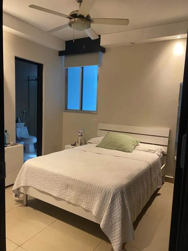 Modern second bedroom with ensuite bath, AC, fan at PH The Palm luxury rental in Obarrio Panama.
