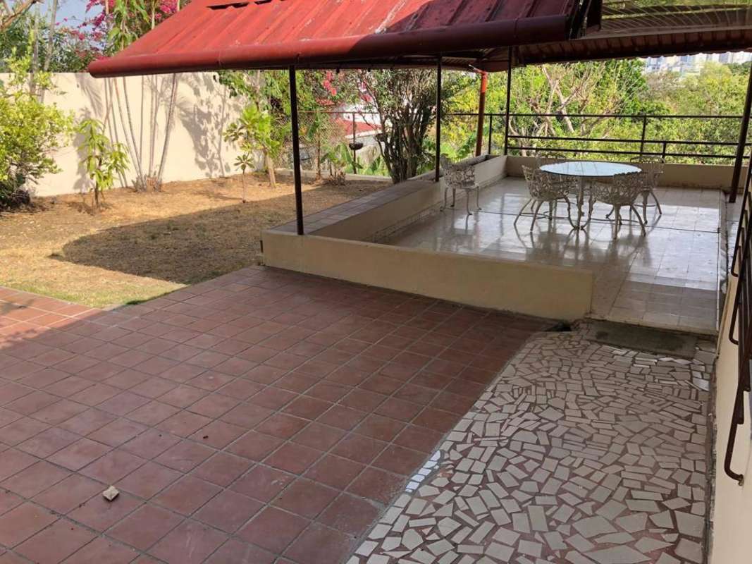 Covered patio with plants, garden view, tiled outdoor area Betania Panama