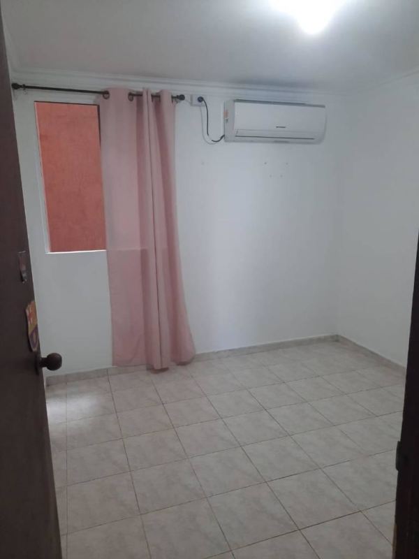 Apartment kitchen with breakfast bar, cabinets, stove and washing machine in PH Residencial Río Abajo Panama