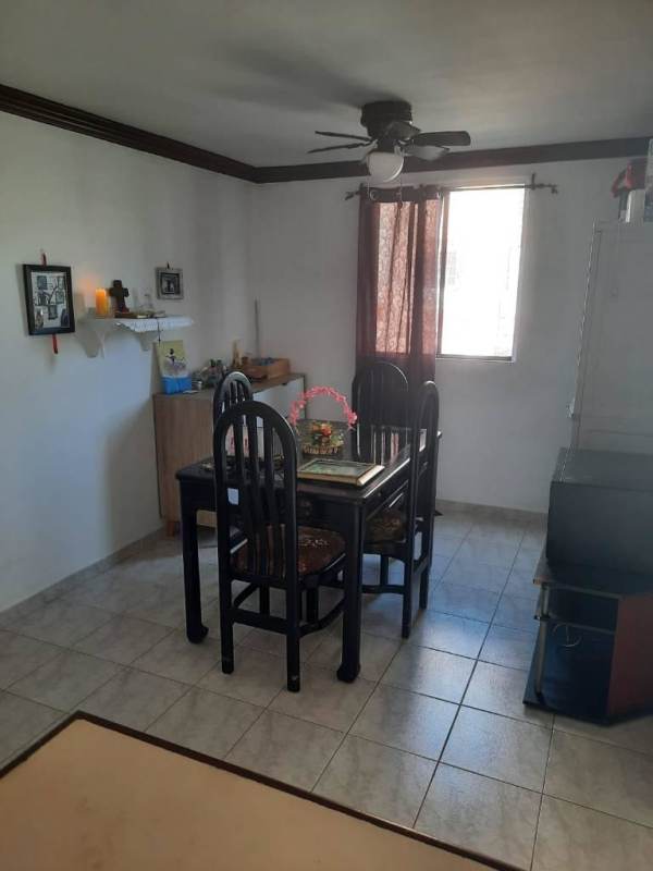Living room in apartment with brown sofa, ceiling fans and open layout in PH Residencial Río Abajo Panama