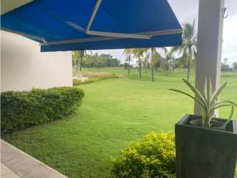 Spacious covered terrace overlooking golf course at Vista Mar villa in San Carlos Panama