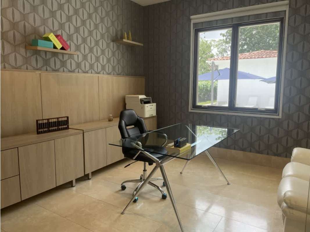 Open layout double-height living space with big windows in Santa Maria estate Panama