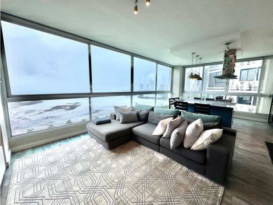 Spacious remodeled living room with floor-to-ceiling oceanfront windows, PH Yacht Club Panama City