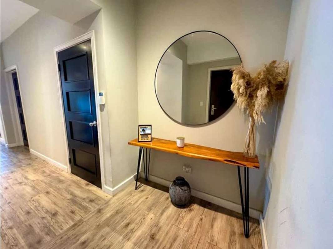 Bedroom with built-in closets and large windows in PH Yacht Club Tower Panama City