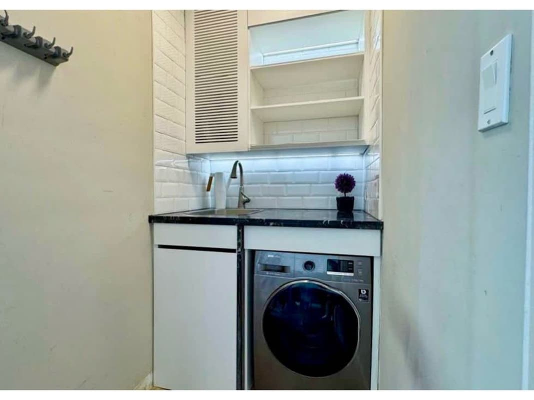 Compact laundry with washer ready, cabinetry at PH Yacht Club Tower Panama City