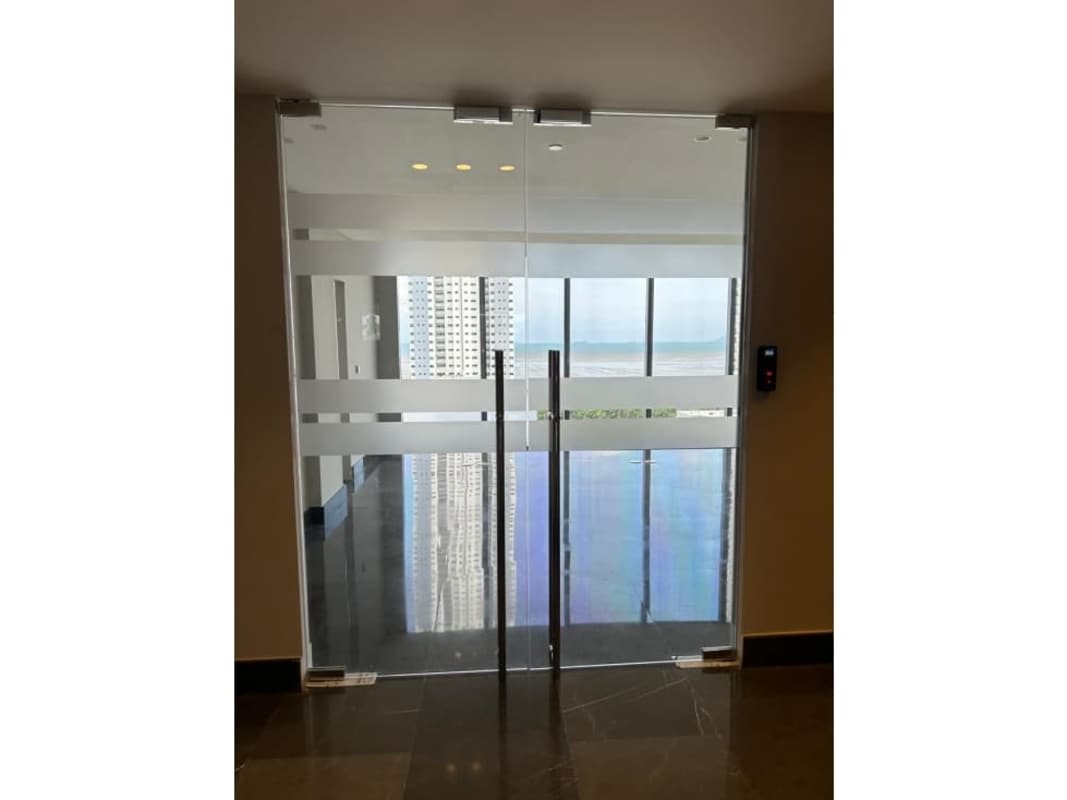Secure lobby entrance glass doors and skyline views at PH Panama Design Center Costa del Este