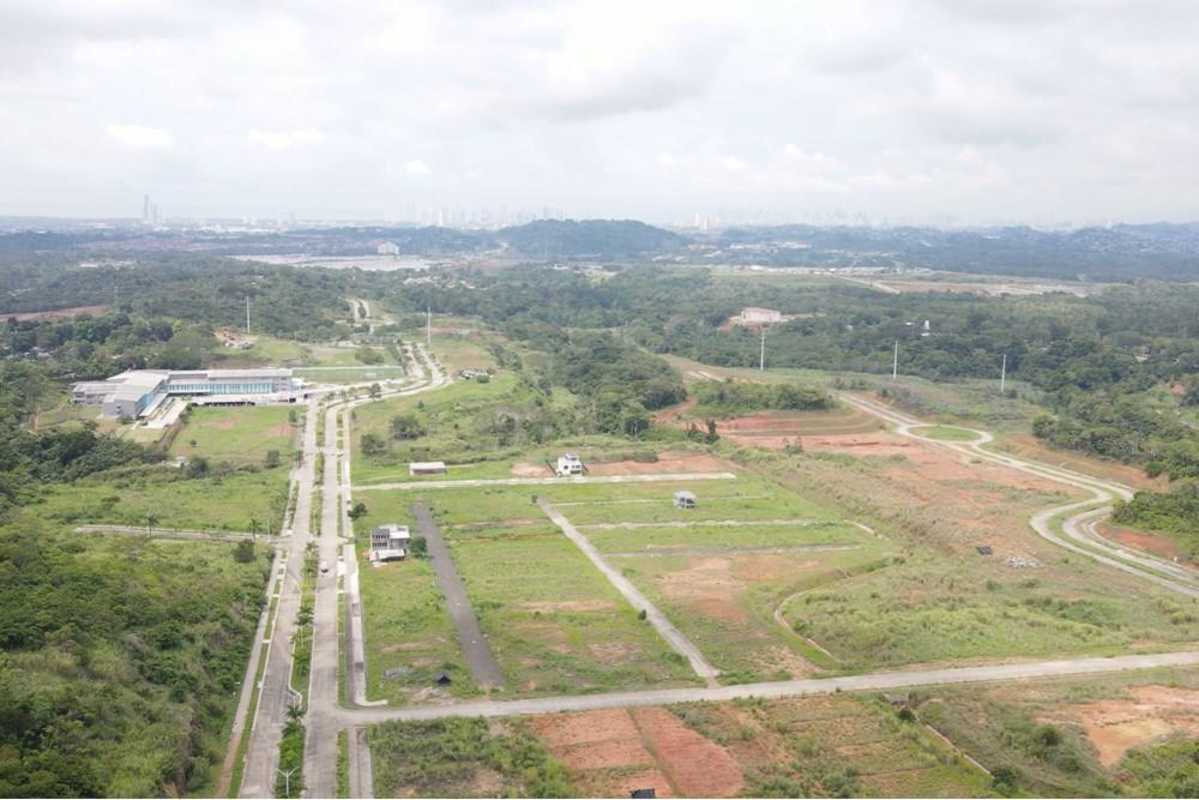 View of paved development roads and surrounding plots Green Valley Panama City