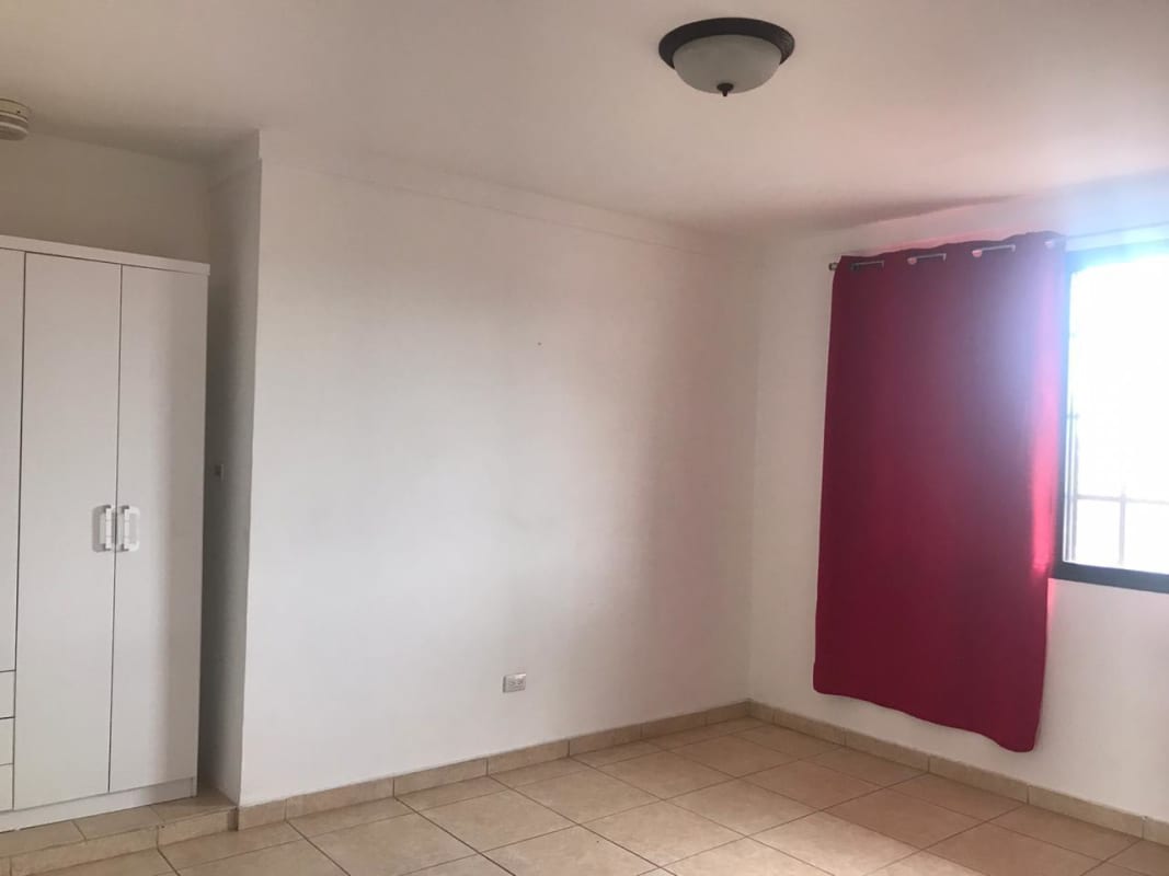 Two-story Mediterranean style house corner lot with tile roof and fenced yard in Brisas del Golf Panama