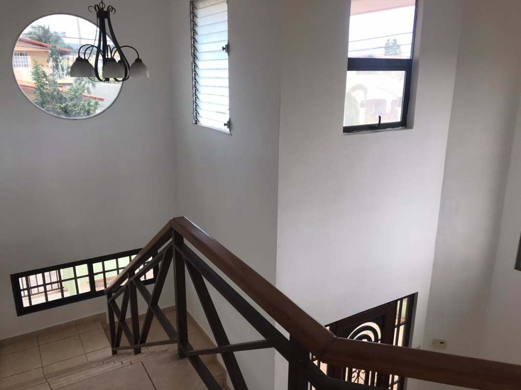 Tiled bathroom with pedestal sink and shower area in Brisas del Golf Panama house