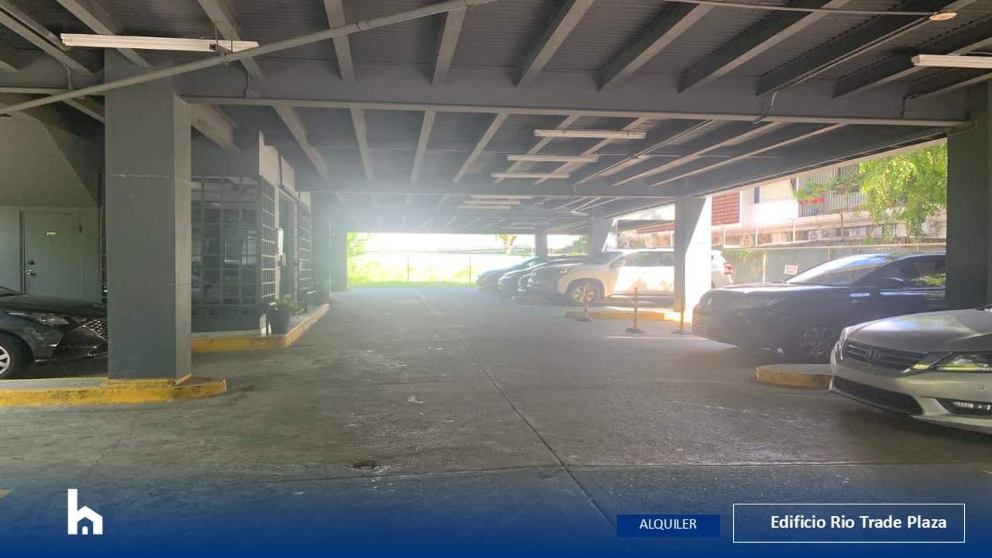 Covered parking area with multiple spaces inside Edificio Rio Trade Plaza