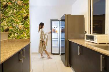 Couple relaxing by luxury tropical pool with lounge chairs in Paradise Point Gorgona Panama