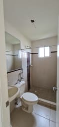 Bathroom with glass shower, toilet and sink corner house La Chorrera for sale