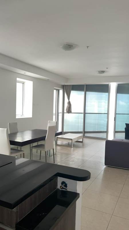 Sleek granite countertop kitchen with appliances in PH Rivage apartment on Avenida Balboa