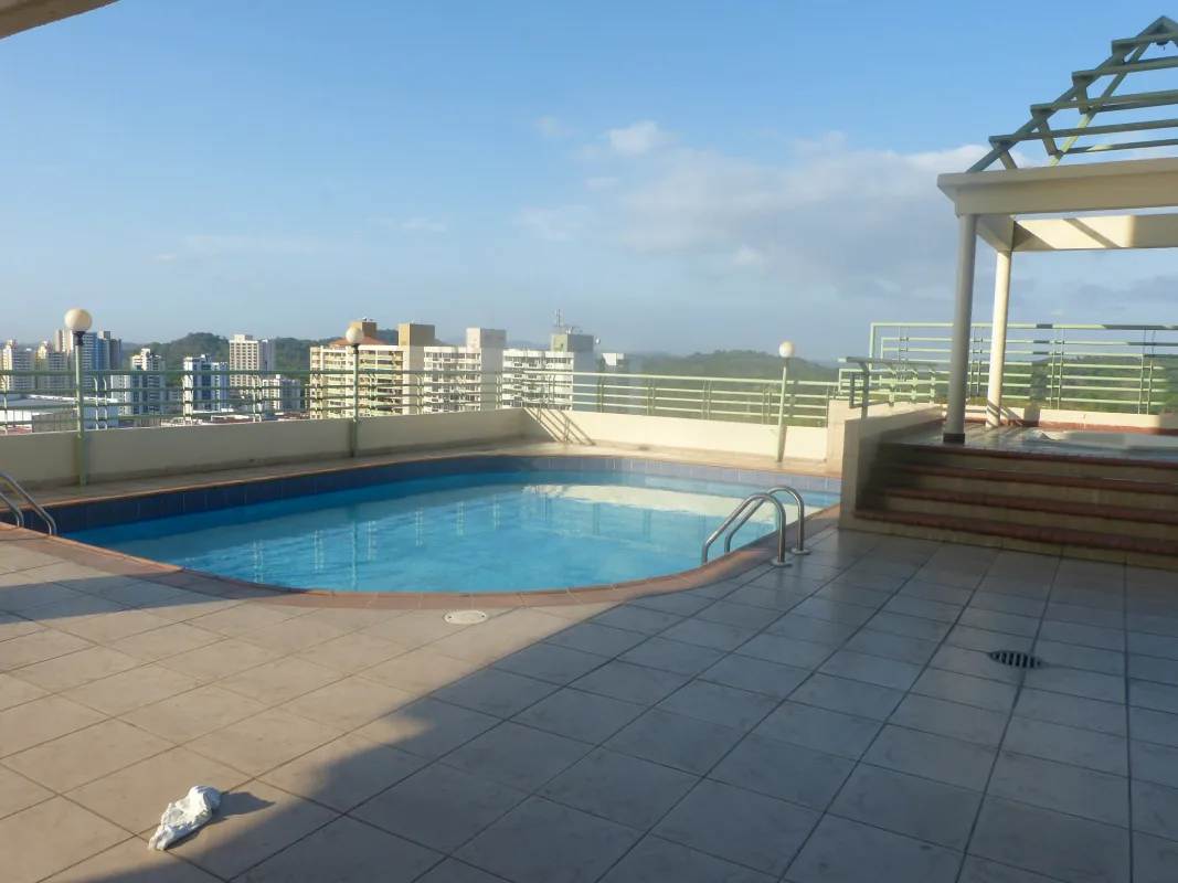 Rooftop pool with city views tiled deck pergola Villa de las Fuentes Panama