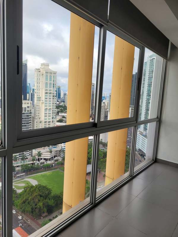 White modern kitchenette and living open floor plan in PH Vista del Mar Panama