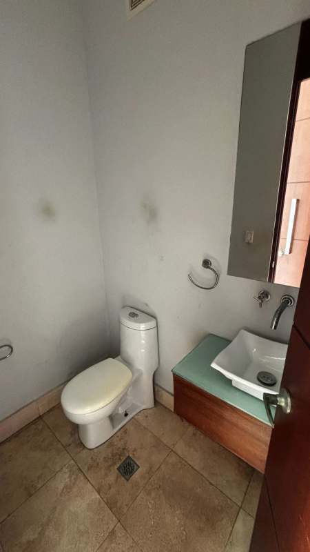 Dining space with double-height windows offering Pacific Ocean views in Punta Pacifica Loft Four41