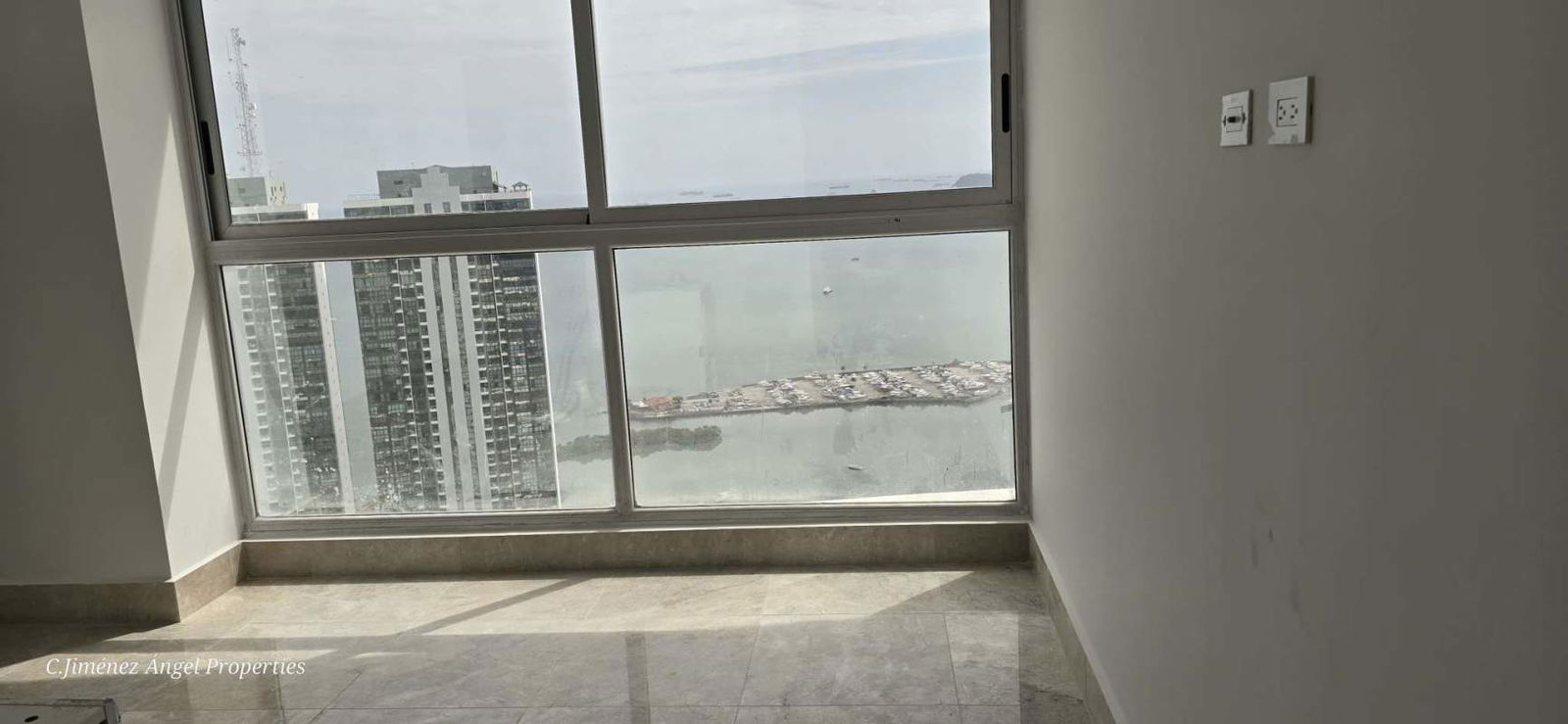 Spacious terrace balcony with panoramic Pacific ocean and skyline views at PH Costanera Panama City