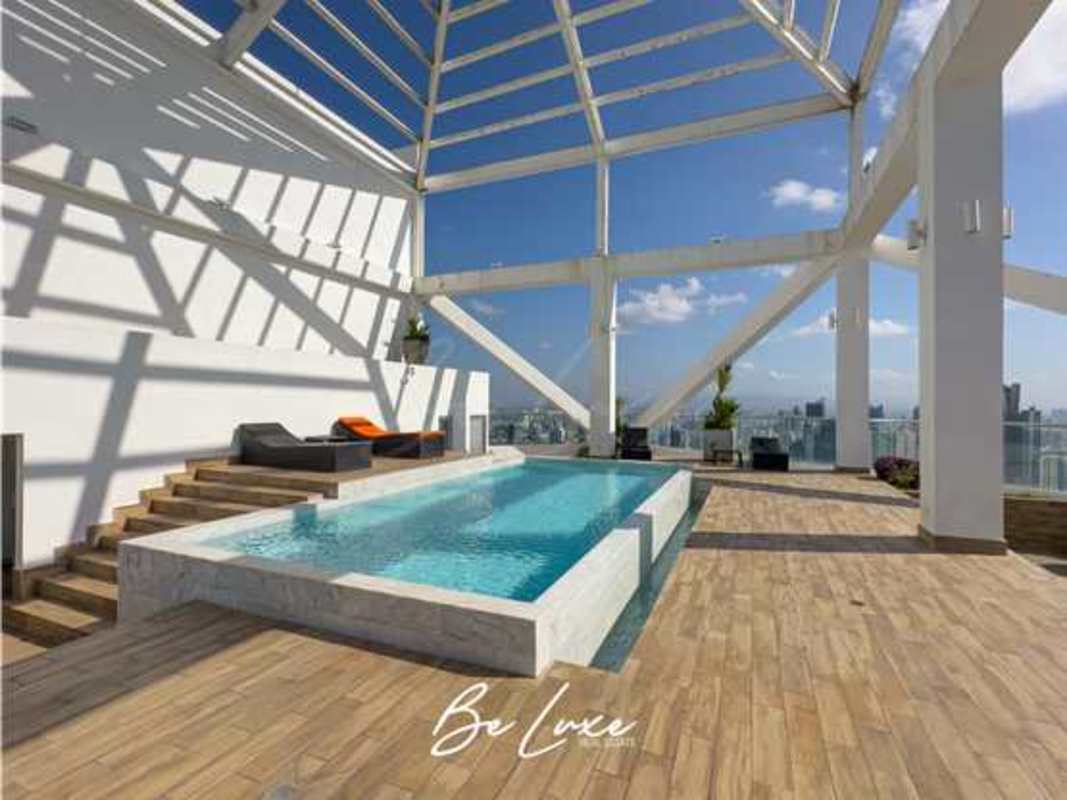 Rooftop tennis court overlooking skyline and hills in Panama City