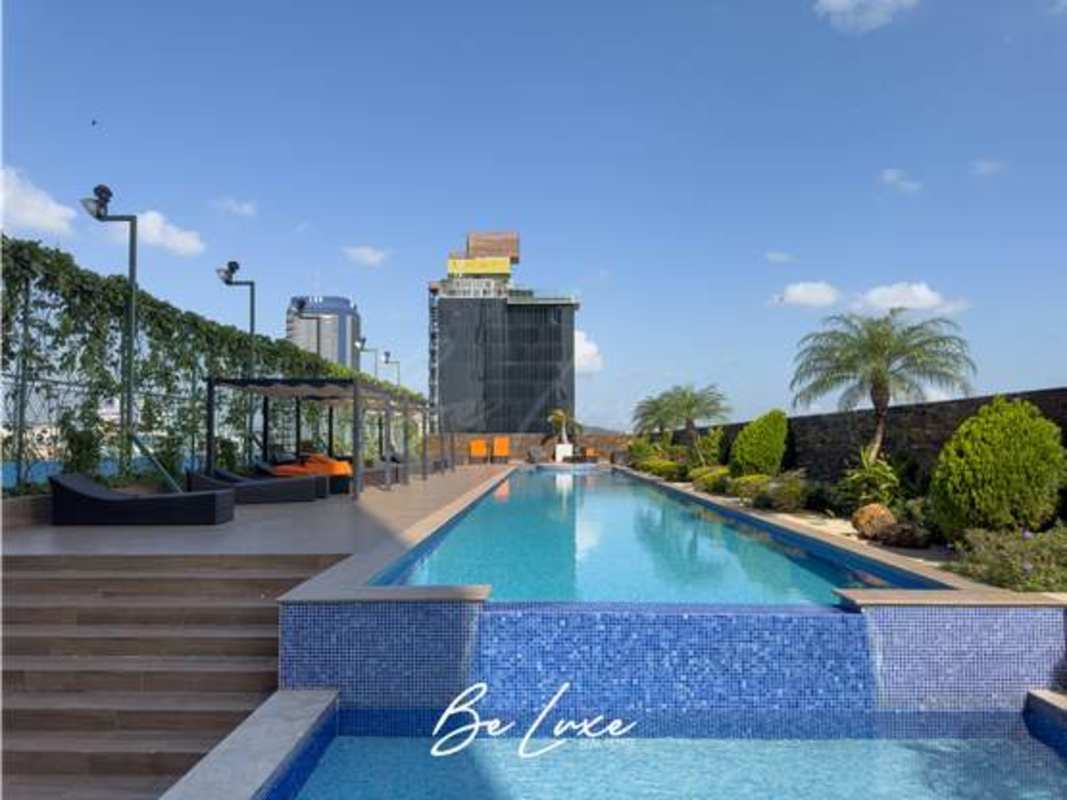 Infinity pool on rooftop of PH Rivage Tower overlooking Panama skyline