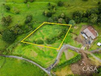 Aerial of organic farm, greenhouses and lush eco community Monte Sereno Volcán