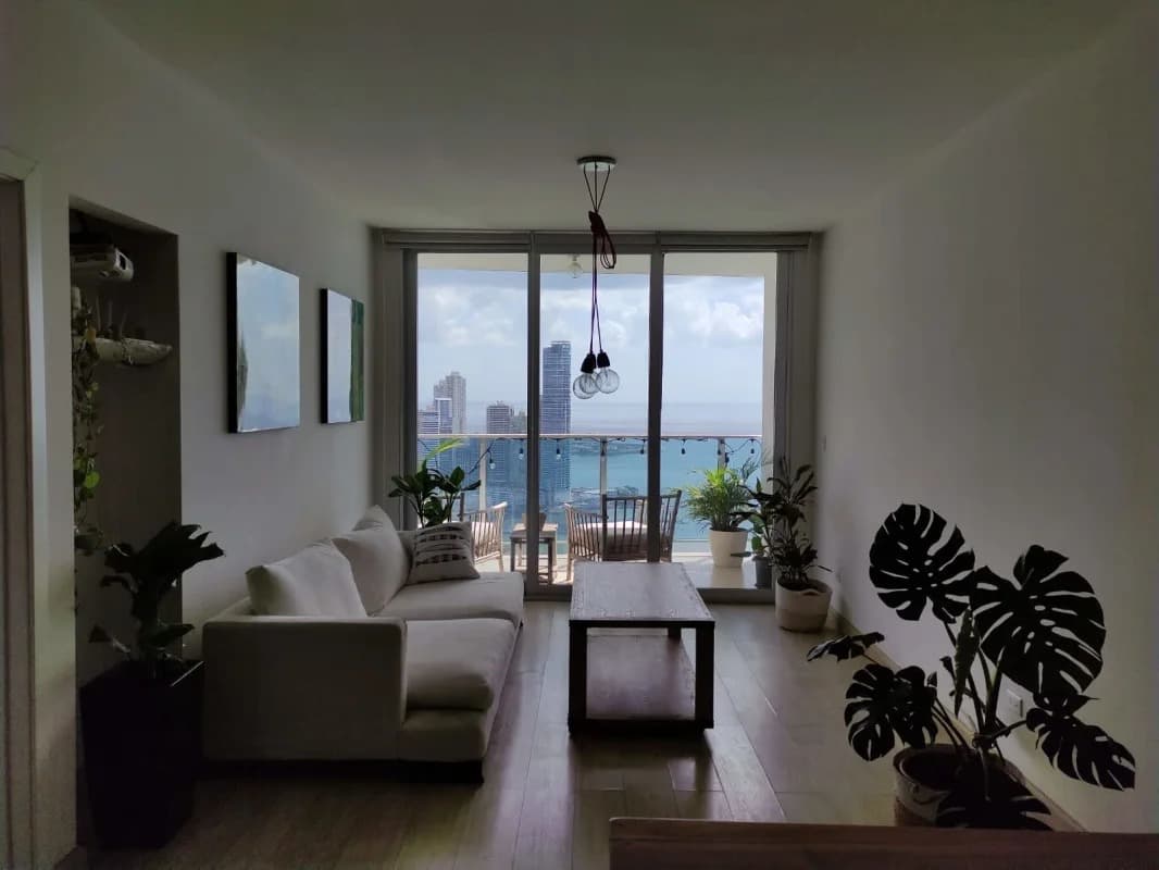 Spacious living room with access to large balcony and stunning ocean city views PH White Avenue Balboa Panama