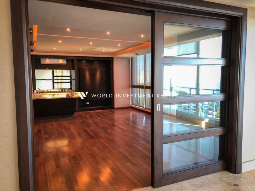 Spacious kitchen with granite countertops, center island, stainless appliances at PH Puntarenas Coco del Mar Panama City