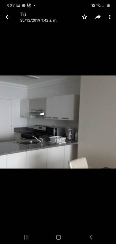 Modern bathroom with granite countertop and shower in luxury PH Miramar apartment in Panama