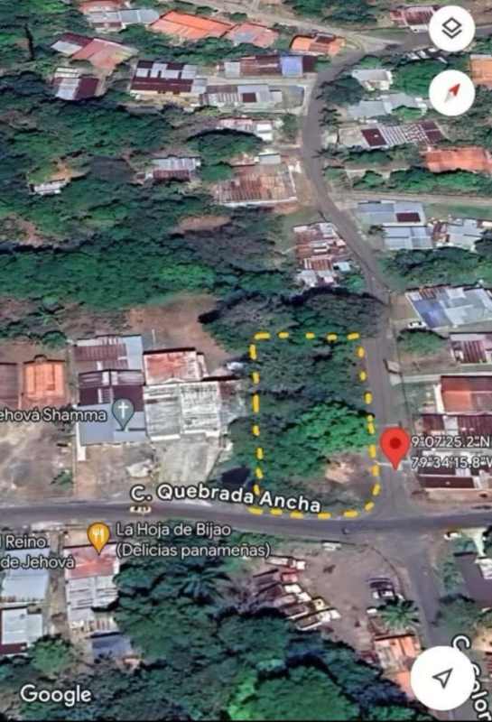 Vacant corner lot with green trees and paved road access in Quebrada Ancha Las Cumbres Panama City