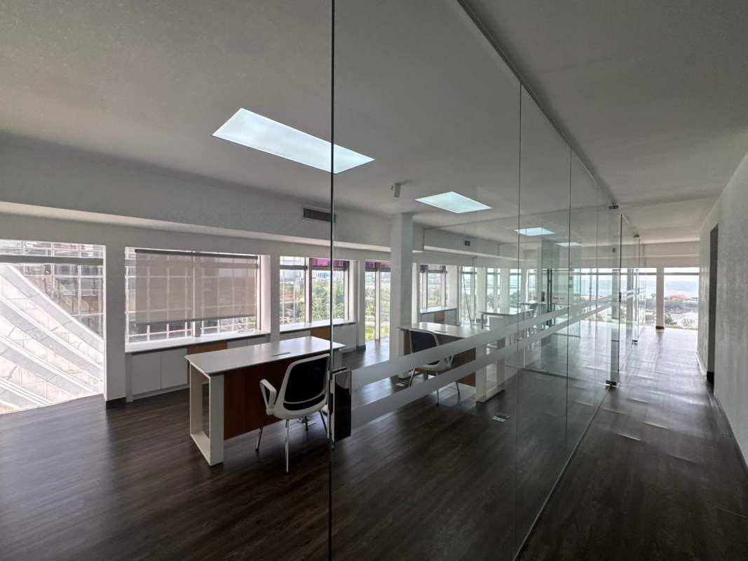 Conference area with glass walls, panoramic city views at PH Torre BAC Panama City