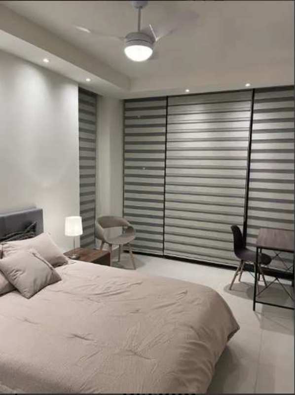 Main bedroom with ensuite bathroom and balcony views at PH Coco del Mar Panama City