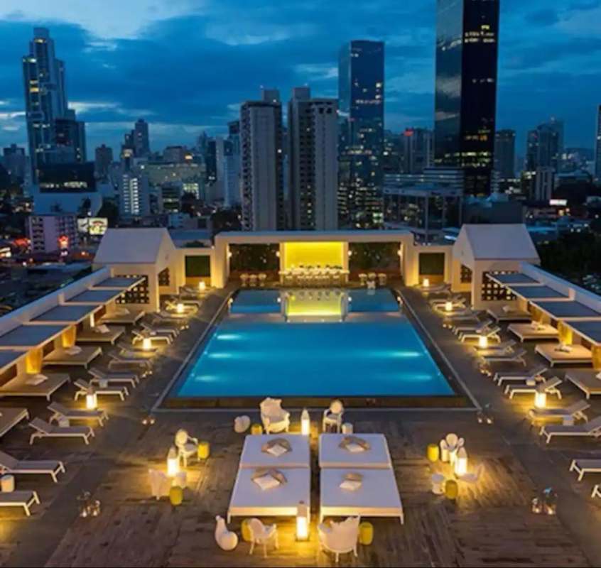 Rooftop infinity pool with lounge panoramic ocean views PH YOO Panama City