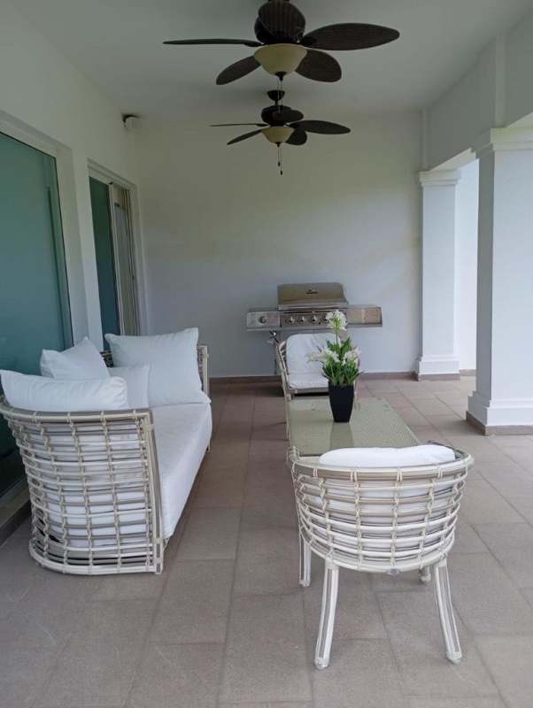 Furnished covered terrace with ceiling fans, BBQ area, green garden Bijao Beach Panama