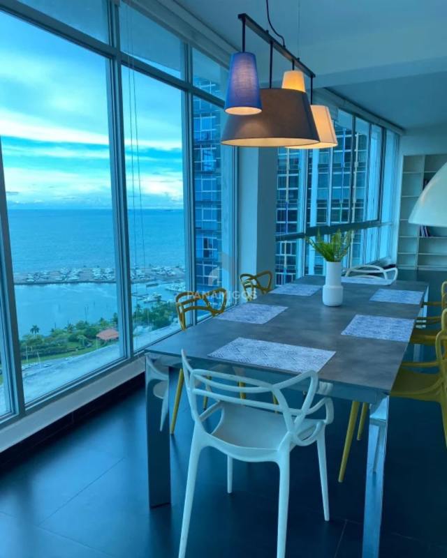 Modern dining space with large oceanfront windows in Marina Park Panama City Panama