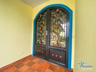 Open concept living room with vaulted ceiling tile floor and bright windows luxury beachfront villa Chiriquí Panama