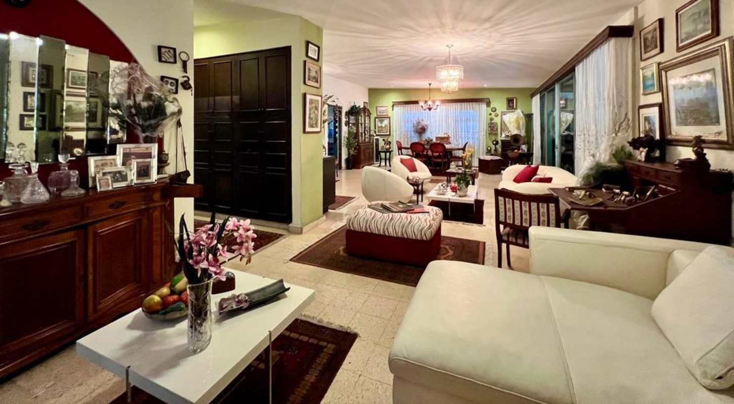 Open living dining area with ample light, traditional décor and wood accents Panama house