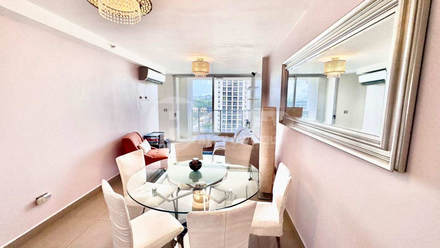 Living room with sliding doors to panoramic balcony in PH Rokas Condado del Rey Panama City